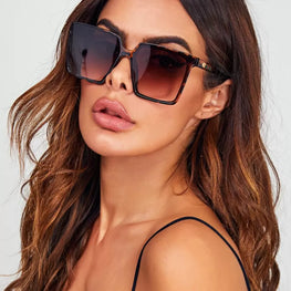 This pair of leopard-print sunglasses combines stylish design with practical protection by fashioncafee.com