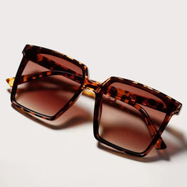 This pair of leopard-print sunglasses combines stylish design with practical protection by fashioncafee.com