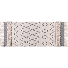 Cotton bedside blanket in front of hand-washing table by Wiio