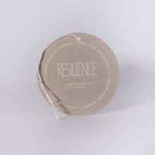 Serenity candle is filled in a beautiful, custom glass vessel with the word by Labyrinth Made Goods