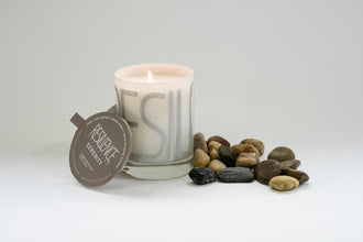 Serenity candle is filled in a beautiful, custom glass vessel with the word by Labyrinth Made Goods